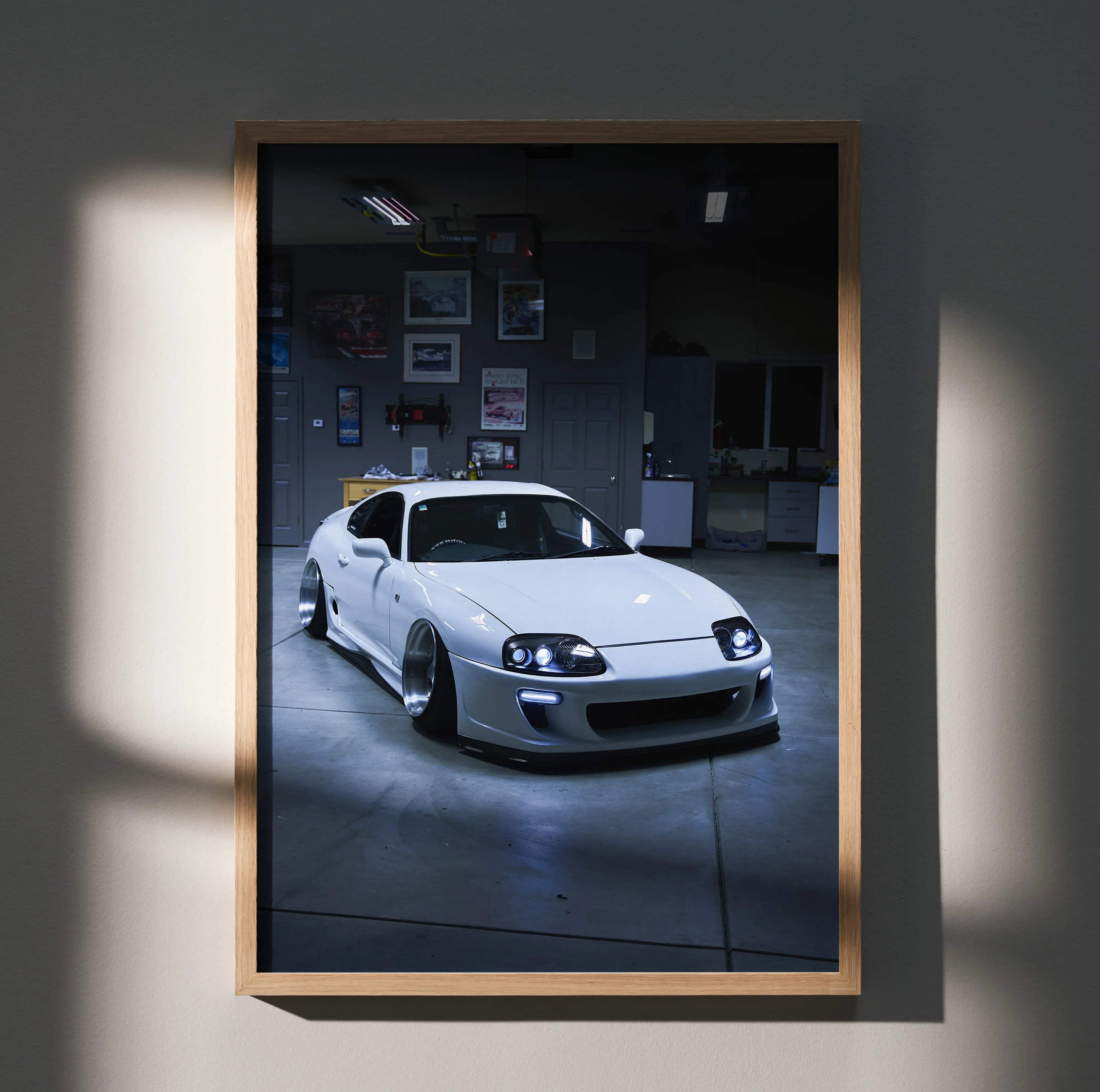 White toyota supra mk4 sports car poster in a wooden frame high resolution automotive art for enthusiasts