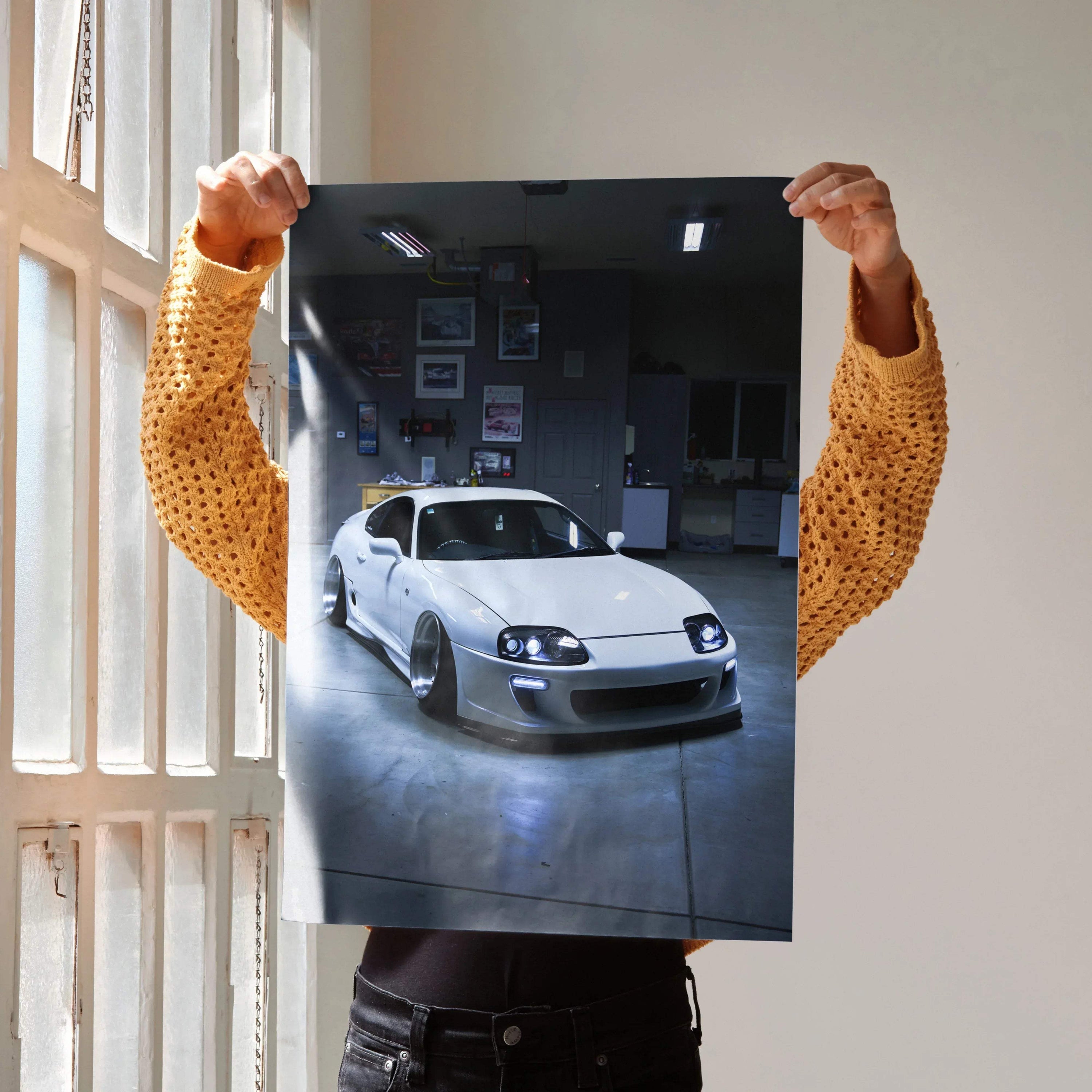 Toyota Supra MK4 poster featuring a white sports car in a garage, high-resolution wall art.