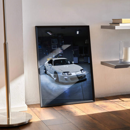 Toyota Supra MK4 poster wall art in sleek black frame with high-contrast automotive design.