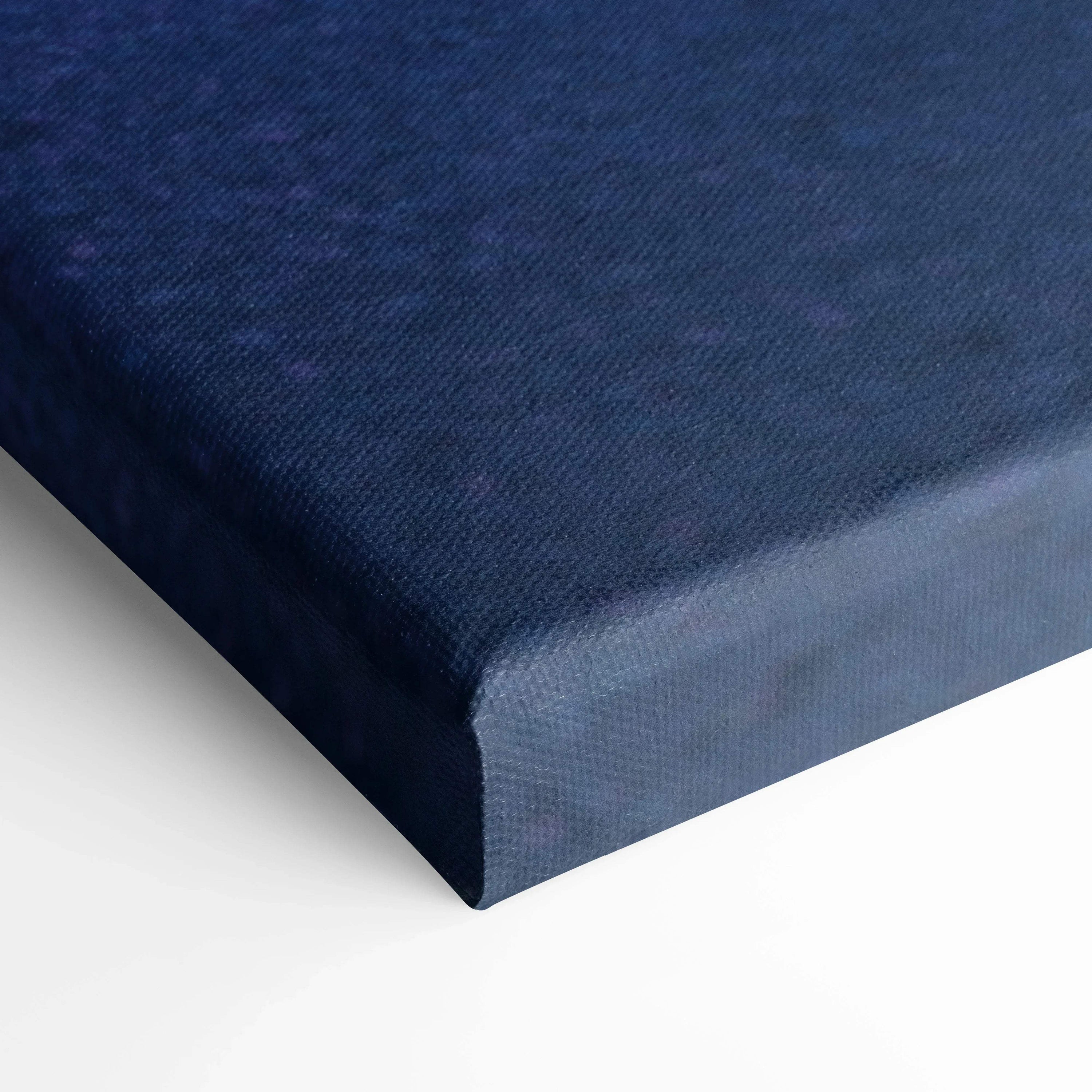 Close-up of dark blue textured canvas wall art corner with crisp edges and museum-quality finish.