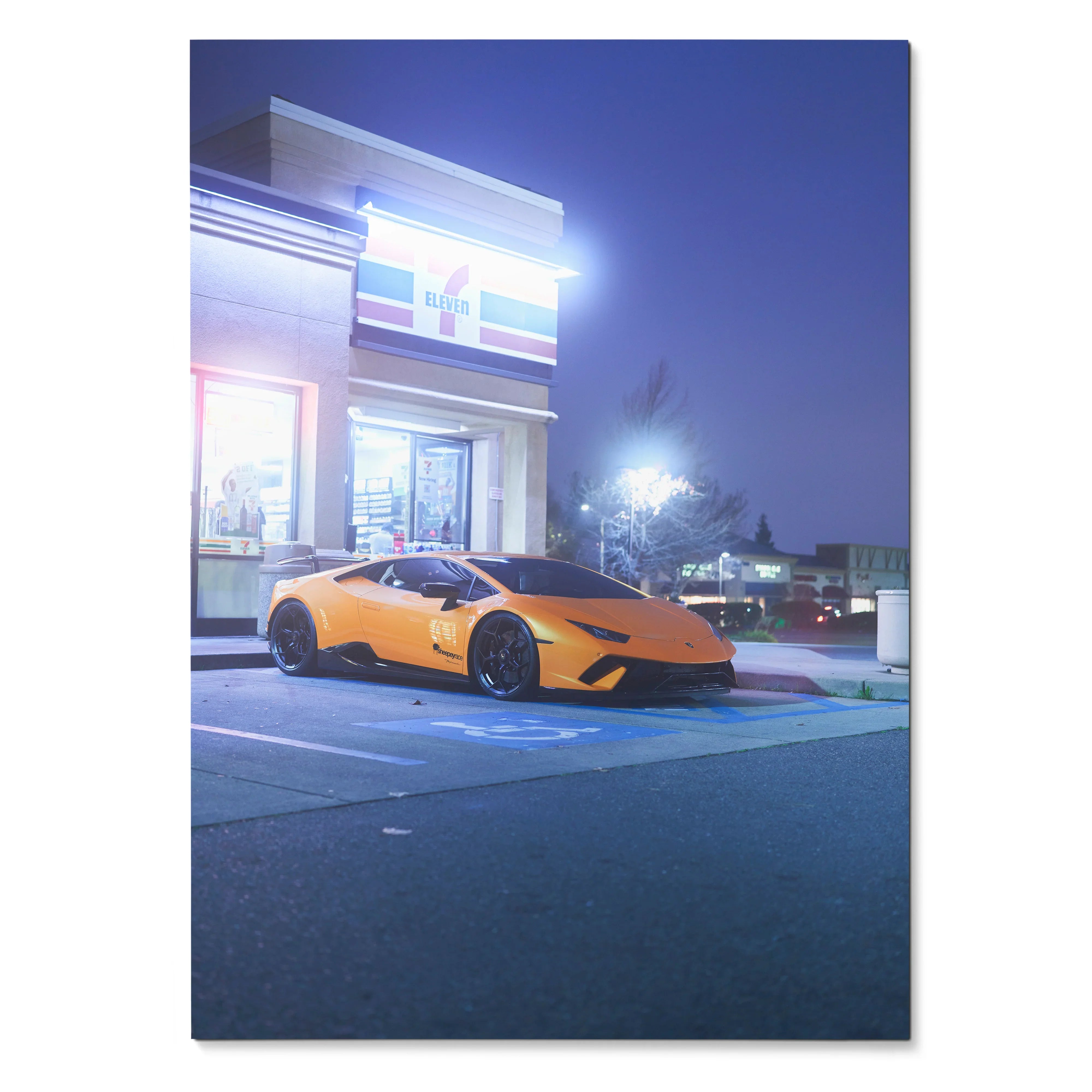 Lamborghini Huracan parked in front of lit modern building at dusk poster wall art.