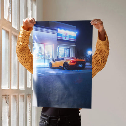 Lamborghini Huracan parked outside a neon-lit building at night poster wall art.