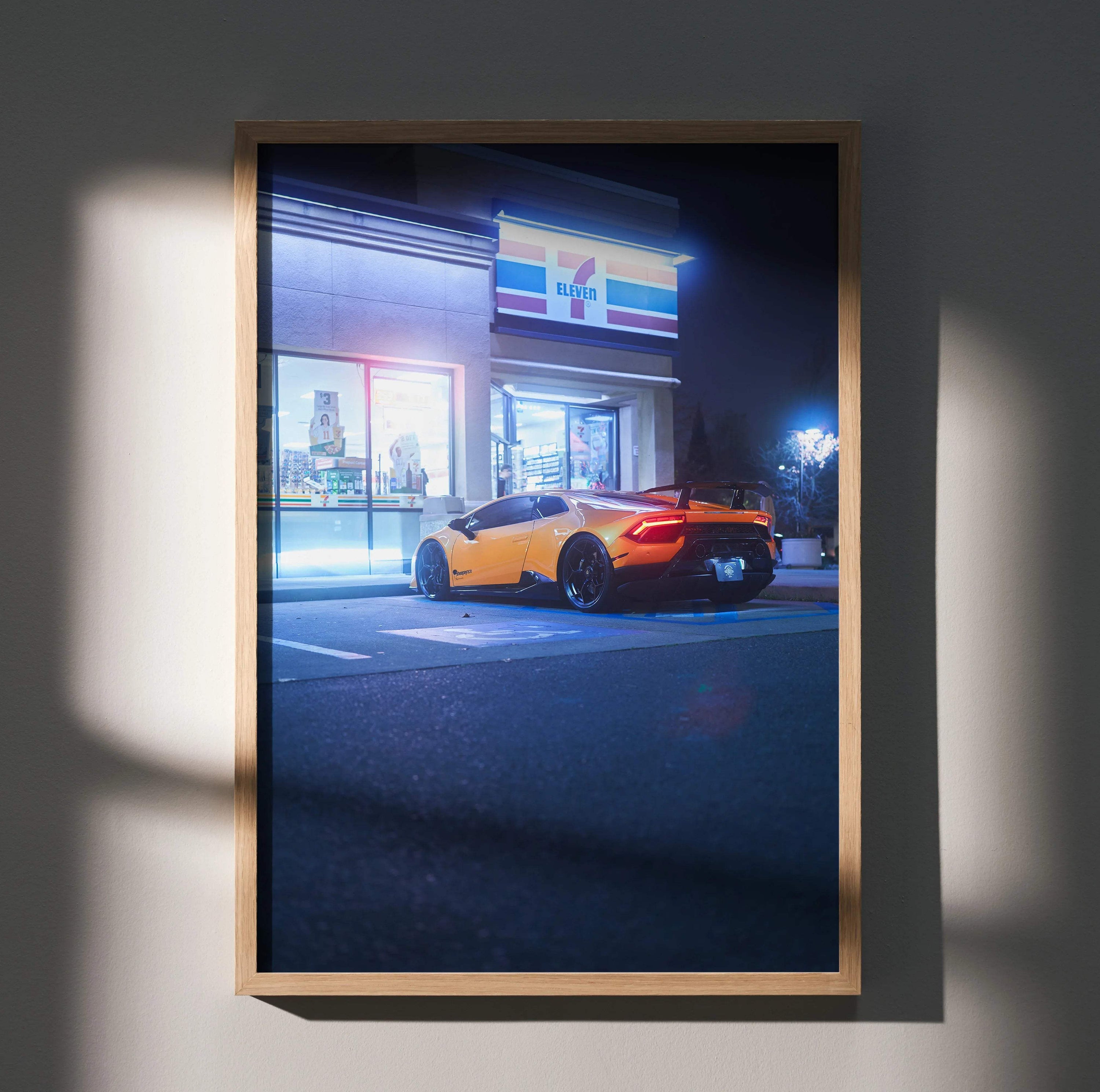 Lamborghini Huracan parked at night outside a brightly lit store poster wall art.