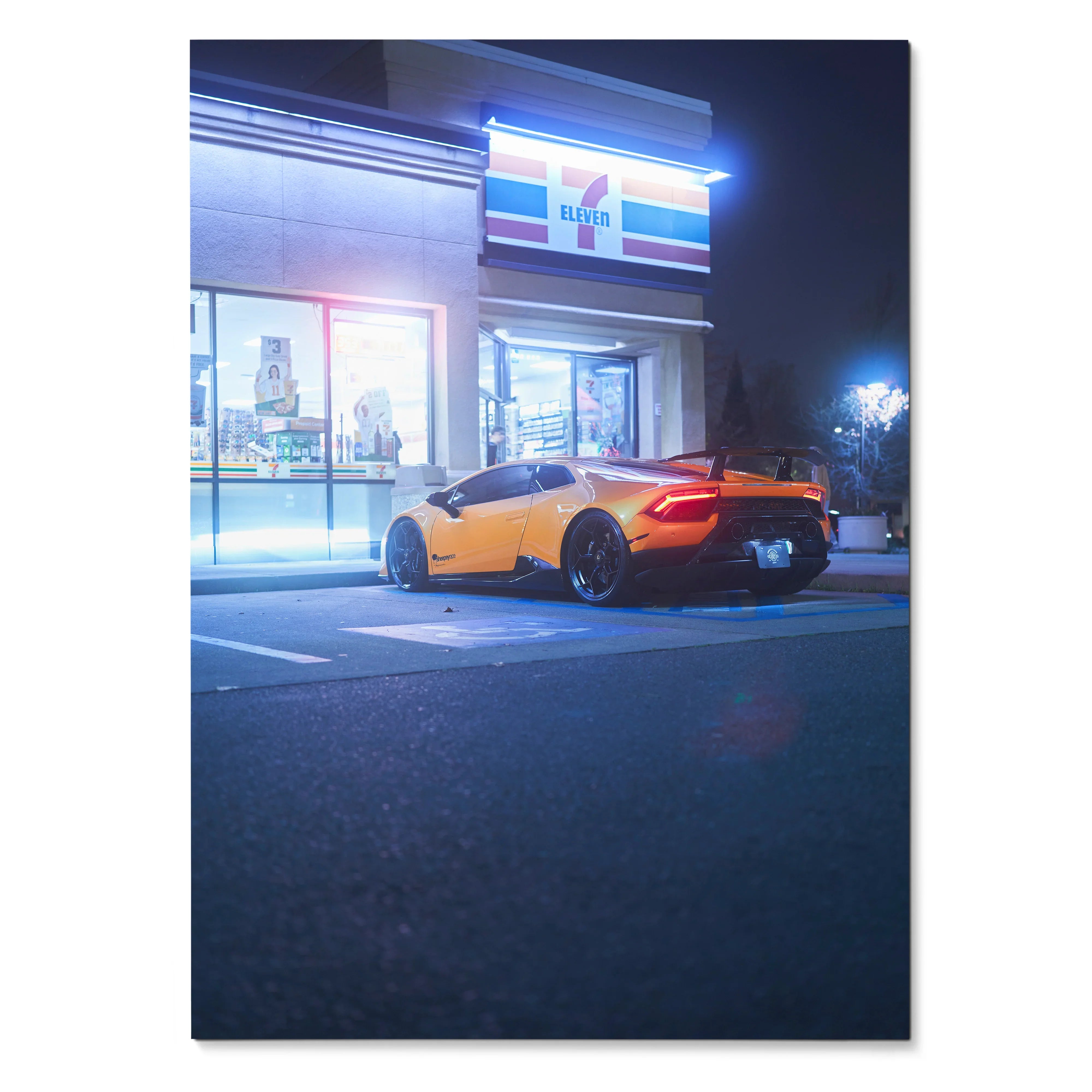 Lamborghini Huracan parked outside illuminated convenience store at night poster wall art.