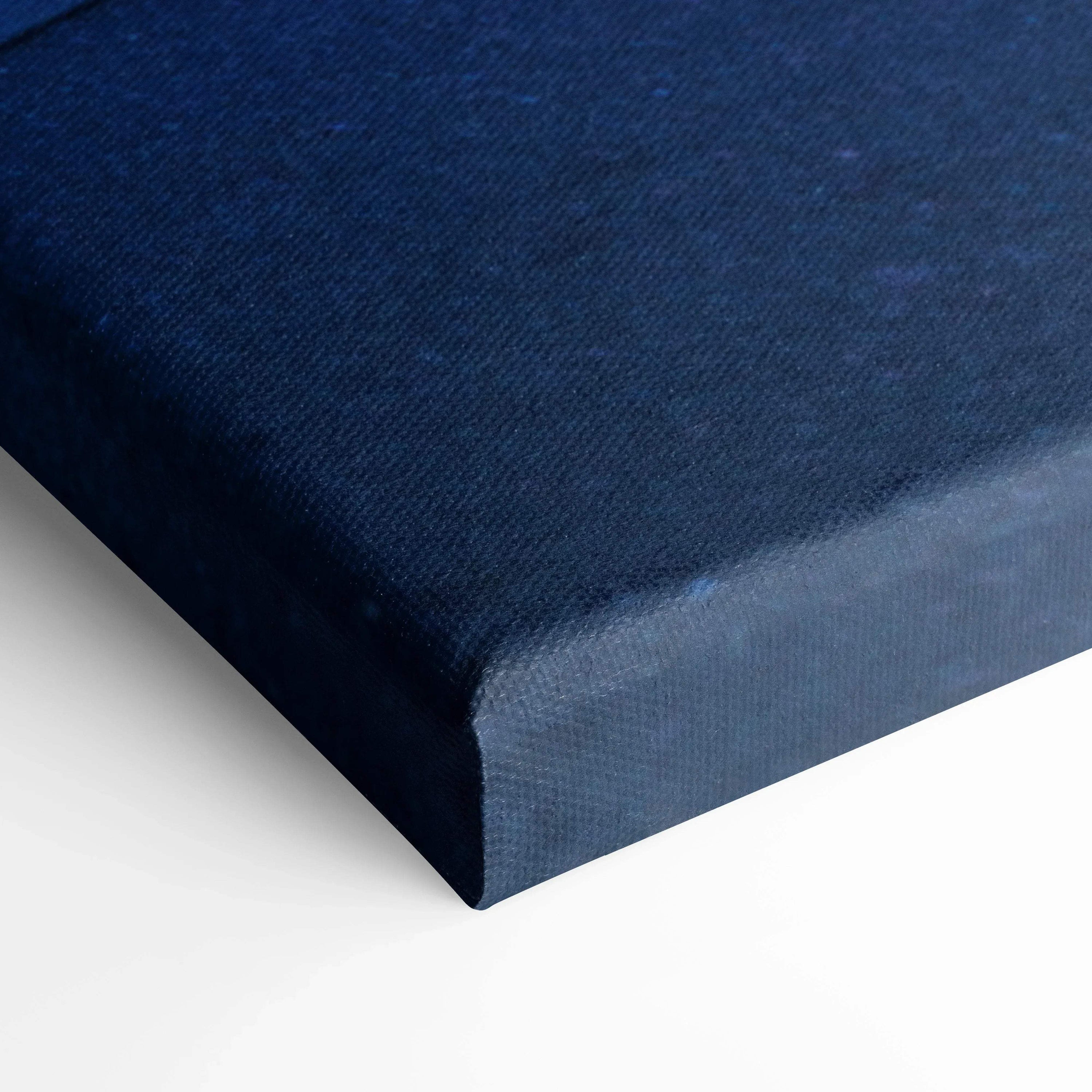 Close-up of dark blue textured canvas edge, showcasing premium museum-quality wall art material.