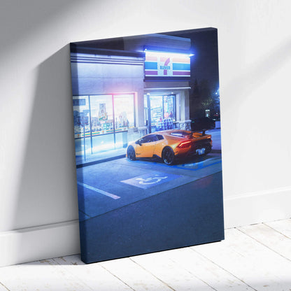 Lamborghini Huracan parked outside lit building at night vertical canvas wall art.