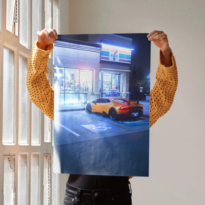 Lamborghini Huracan parked outside illuminated building at night poster wall art.