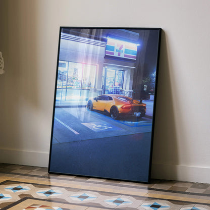 Lamborghini Huracan poster in black frame leaning against wall as modern wall art.