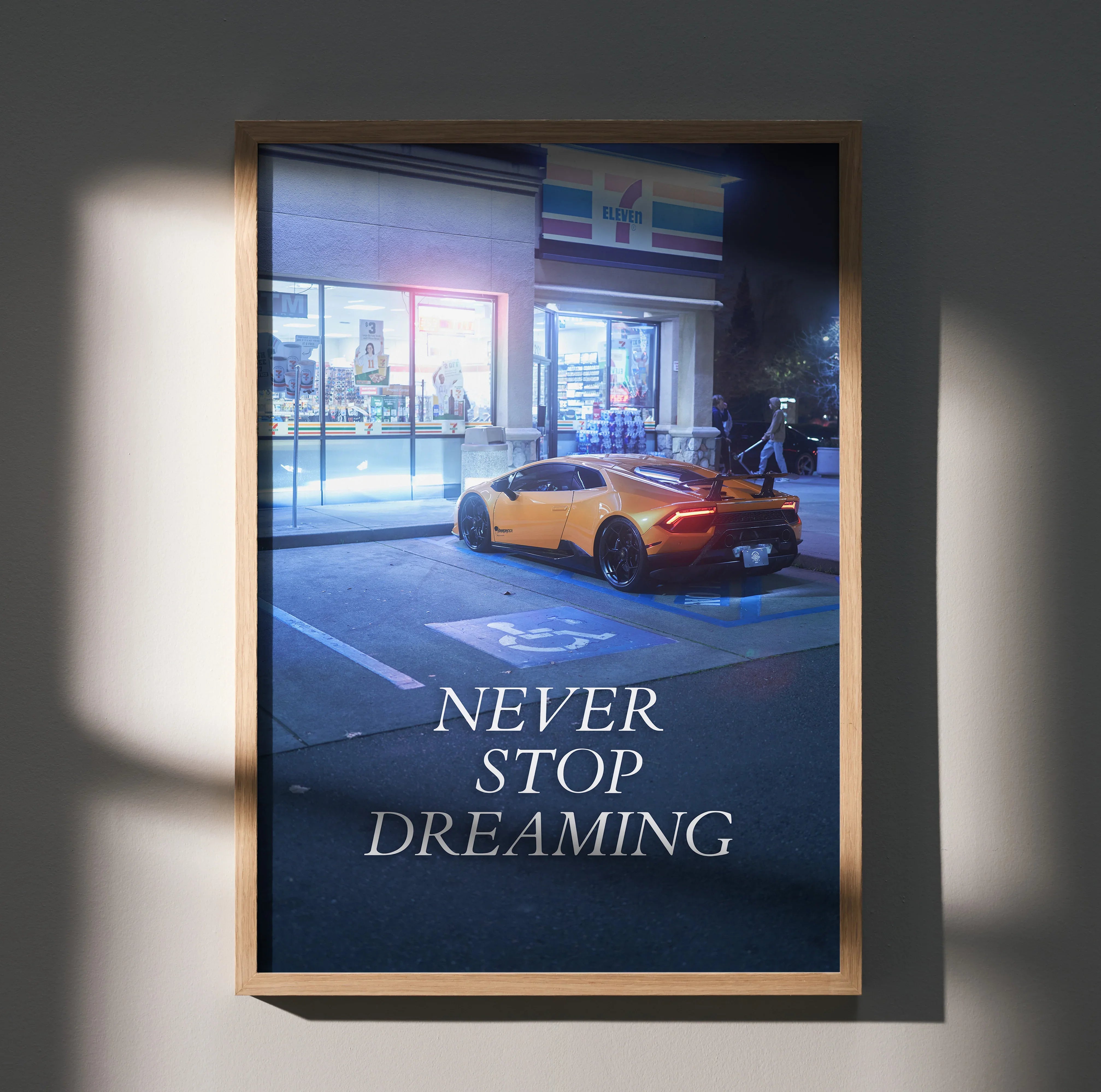 Motivational poster wall art featuring a yellow Lamborghini Huracan with "Never Stop Dreaming" text.