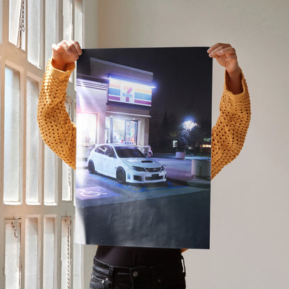 Subaru WRX STI poster wall art featuring a white car in a nighttime urban setting.
