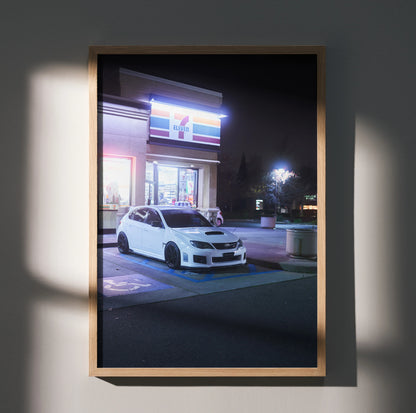 Subaru WRX STI parked at night under neon lights poster wall art in wooden frame.