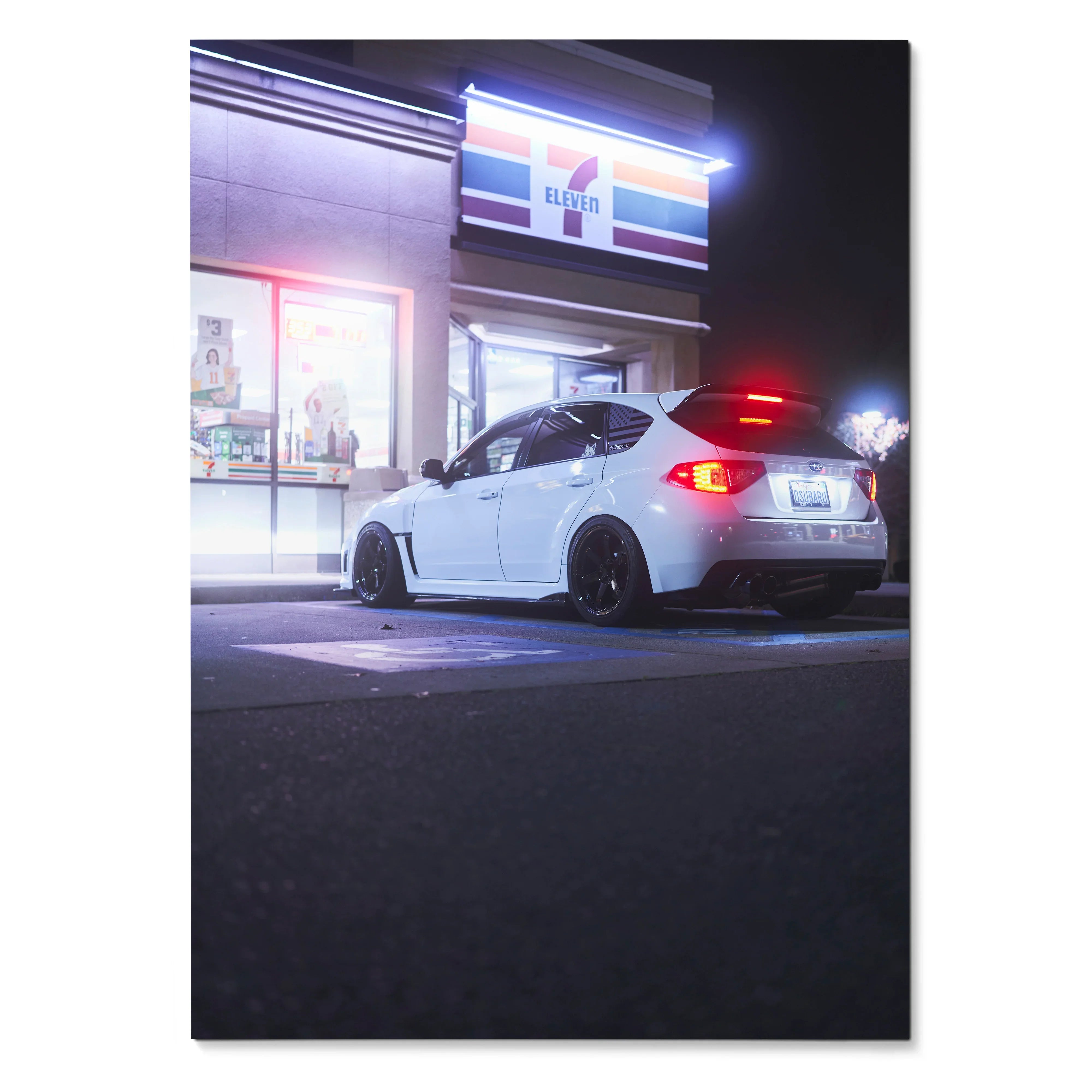 Subaru WRX STI parked outside illuminated convenience store at night poster wall art.
