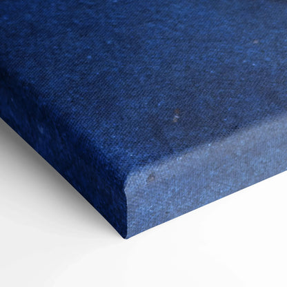 Close-up of deep blue textured canvas art print with wrapped edges for wall art display.