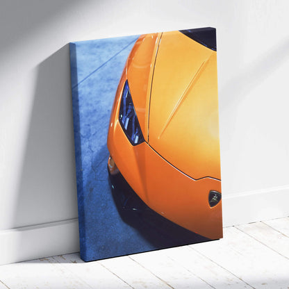 Orange Lamborghini Huracan close-up on blue background vertical canvas wall art.