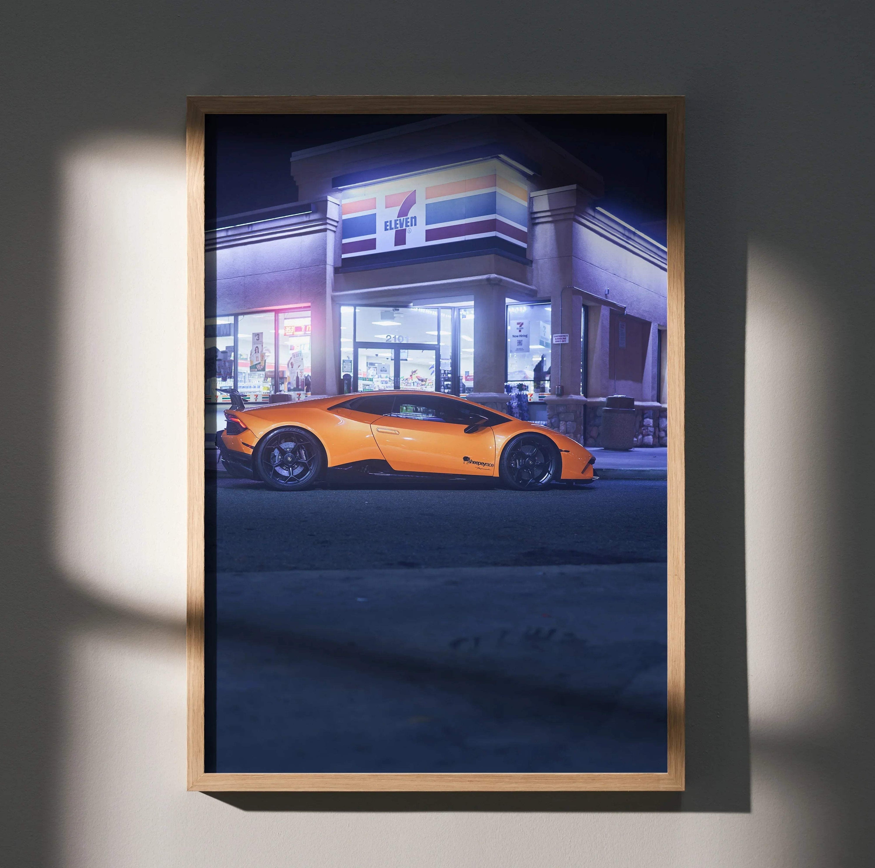 Orange Lamborghini Huracan parked outside illuminated convenience store at night poster wall art.