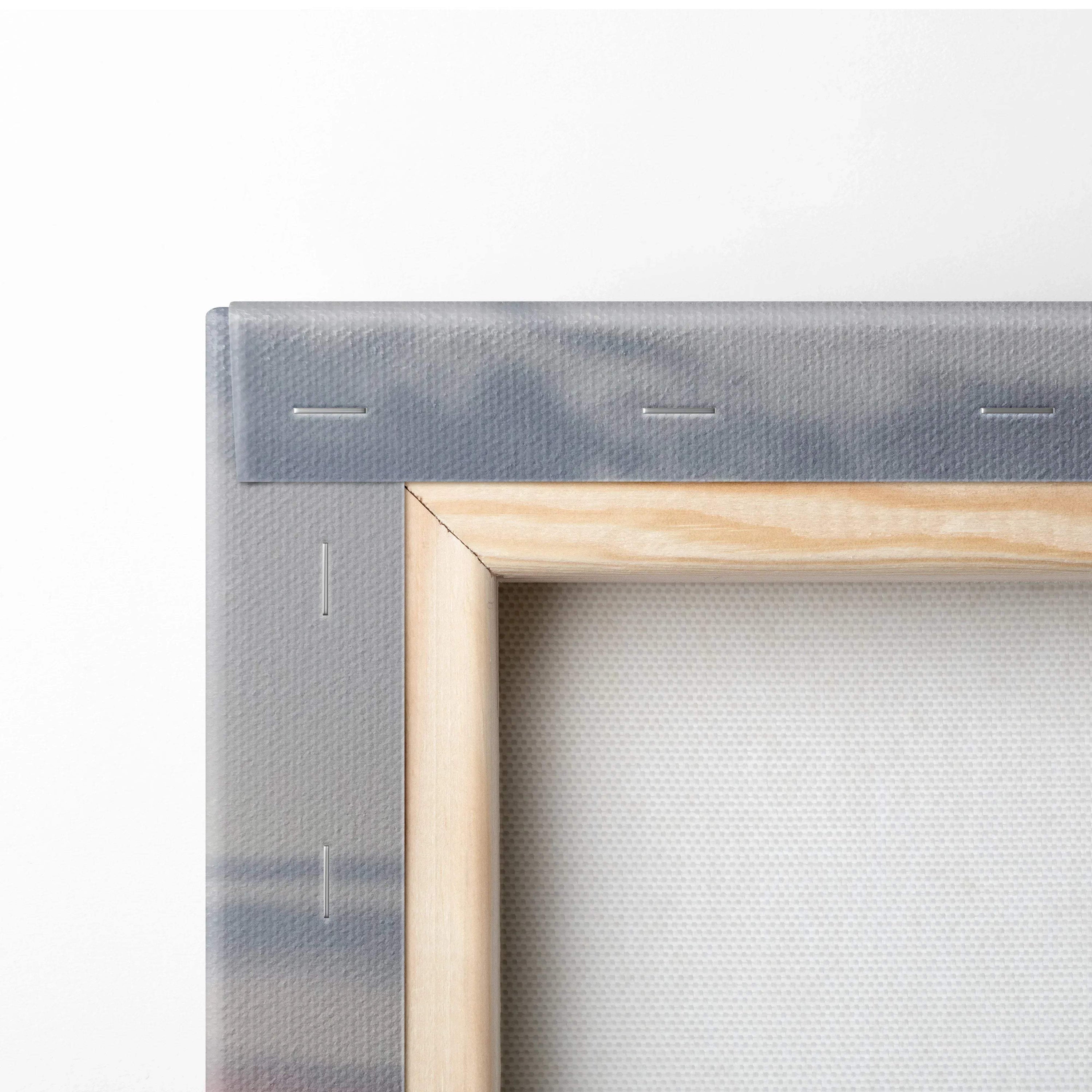 Close-up of wooden frame corner with canvas stretched and stapled, showcasing quality canvas art wall decor.