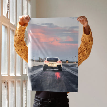Nissan GTR R35 racing poster wall art with sunset sky and wet track reflections.
