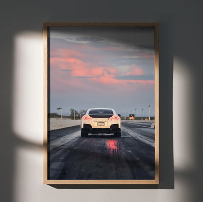 Nissan GTR R35 on racetrack at sunset high-resolution poster wall art in wooden frame.