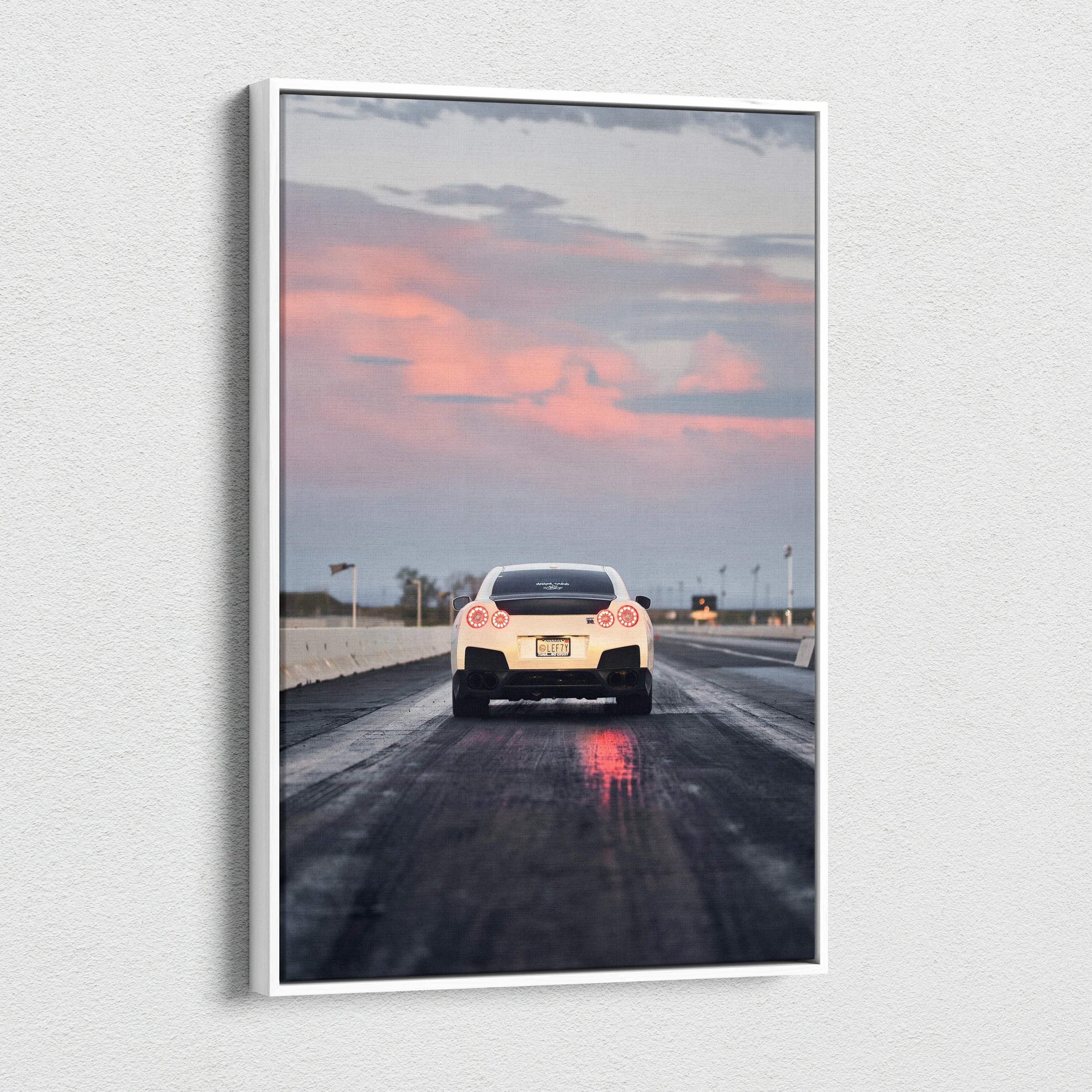 Nissan R35 GTR on wet road under pink sunset sky vertical canvas wall art.