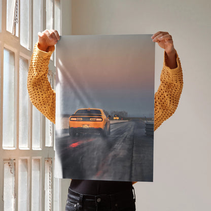 Dodge Challenger poster showing rear view of orange muscle car on rainy road, automotive wall art.