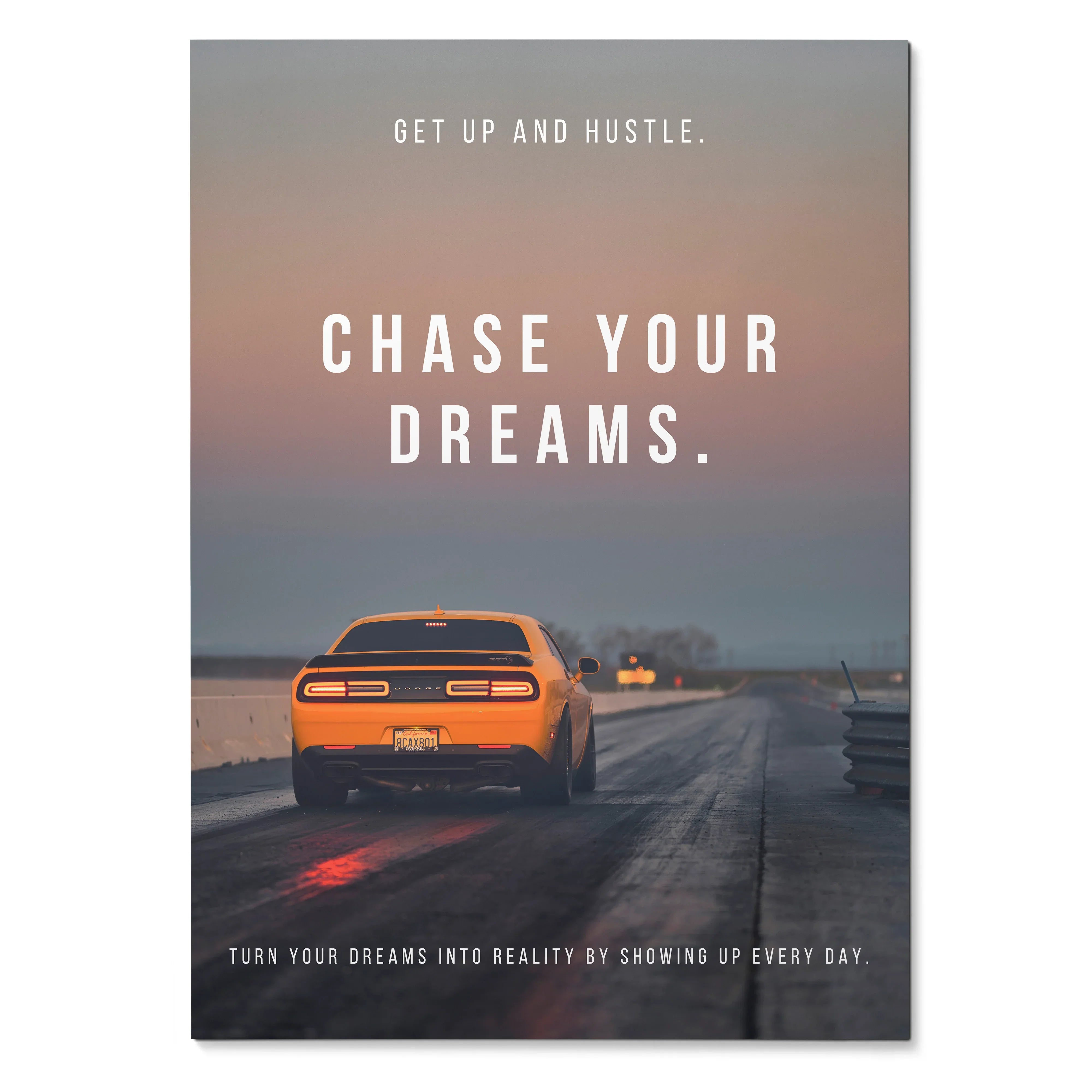 Motivational wall art poster featuring orange Dodge Challenger on road at sunset with inspiring text.