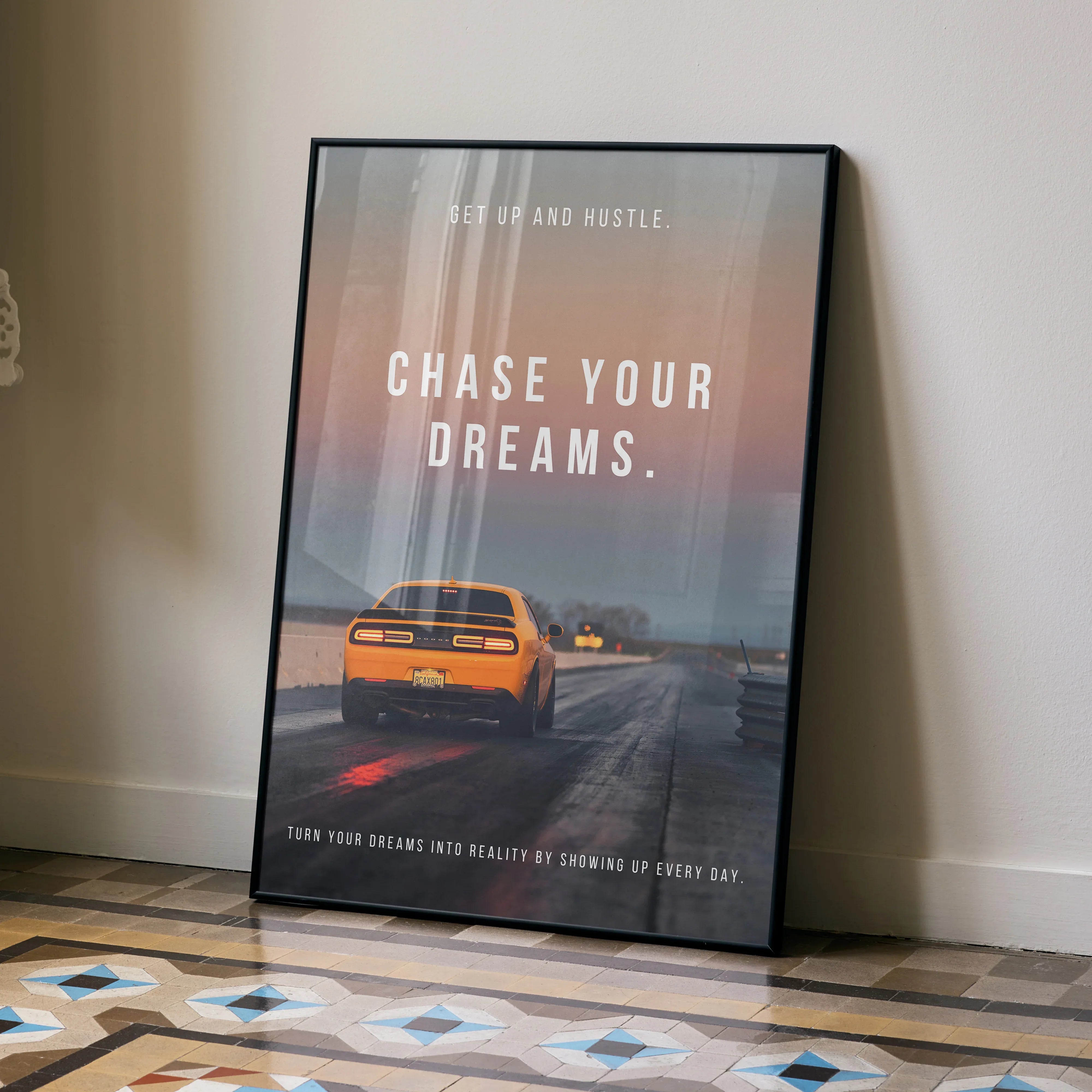 Motivational poster wall art featuring a yellow Dodge Challenger on a road with "Chase Your Dreams" text.
