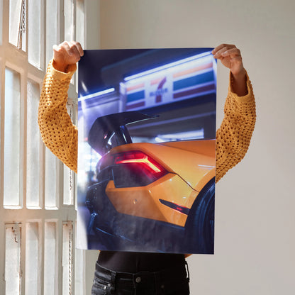 Lamborghini Huracan rear view with bright taillights poster wall art in vibrant urban night setting.