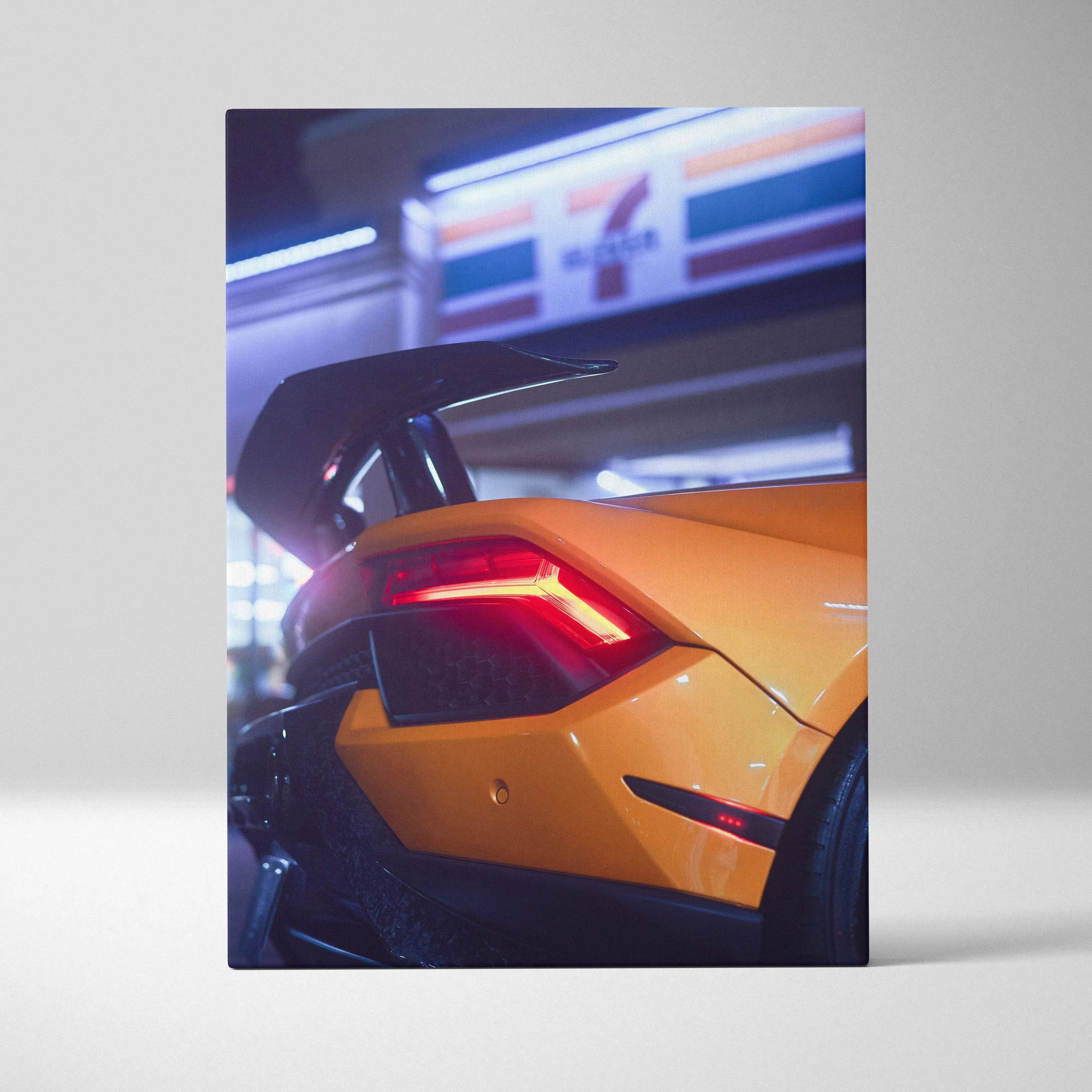 Yellow Lamborghini Huracan rear close-up with illuminated brake light on vertical canvas wall art.