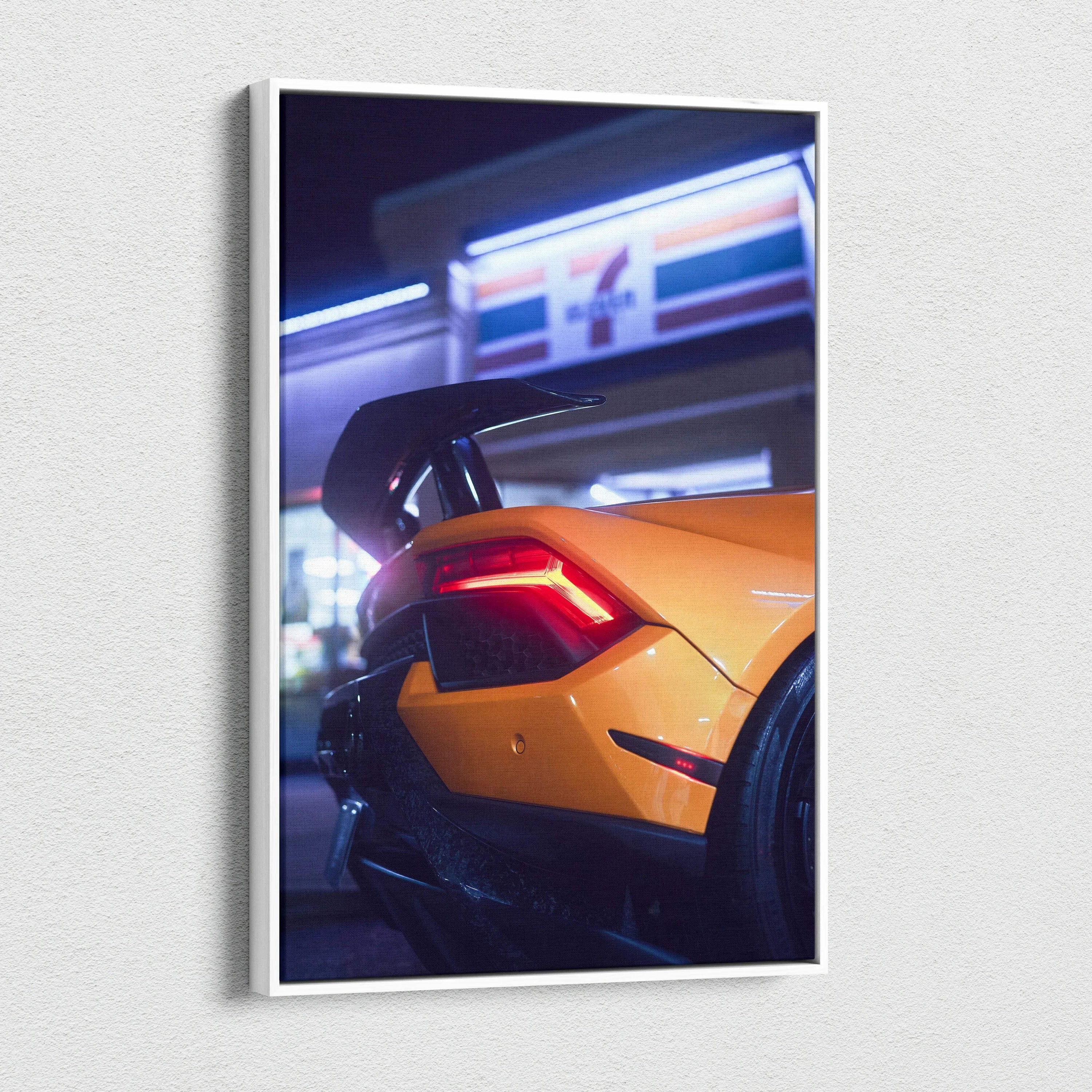 Orange Lamborghini Huracan rear close-up at night canvas wall art with modern urban background.