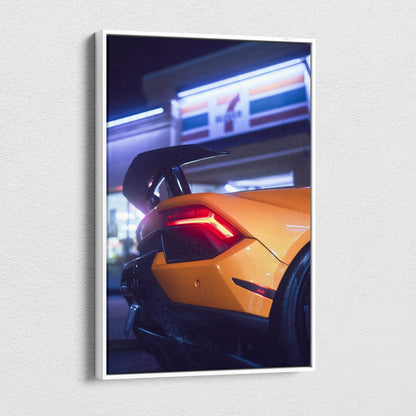 Orange Lamborghini Huracan rear close-up at night canvas wall art with modern urban background.