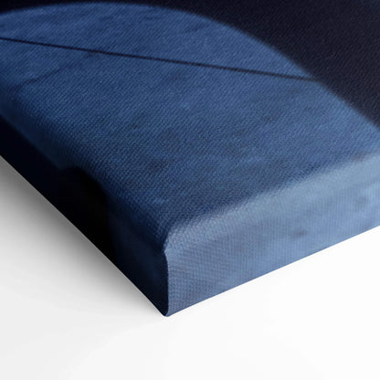 Blue textured canvas edge with black shadow detail, close-up of vertical wall art canvas print.