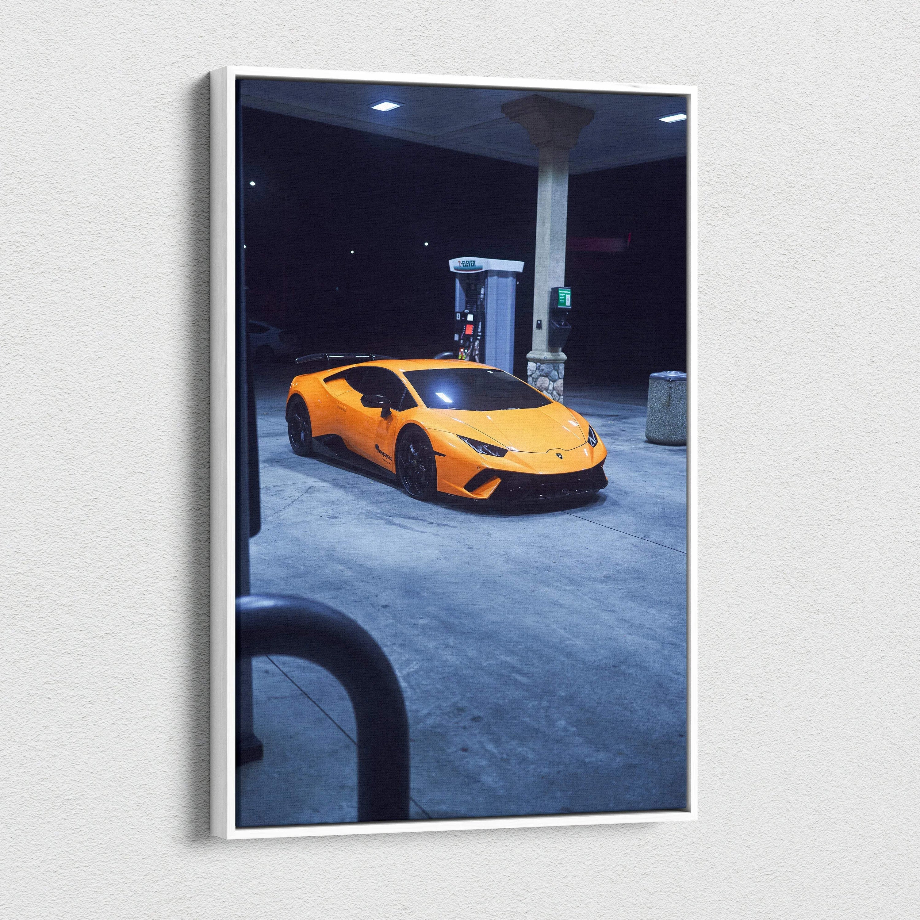 Vertical canvas art wall print of orange Lamborghini Huracan at gas station at night.