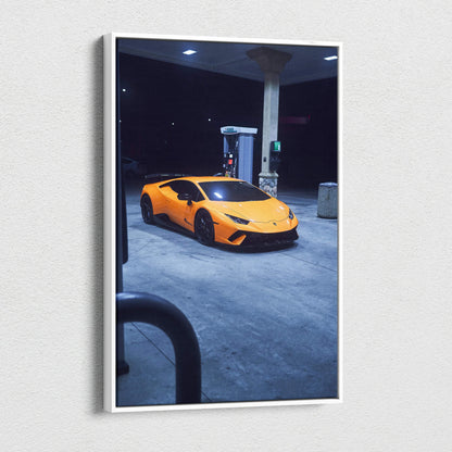 Vertical canvas art wall print of orange Lamborghini Huracan at gas station at night.
