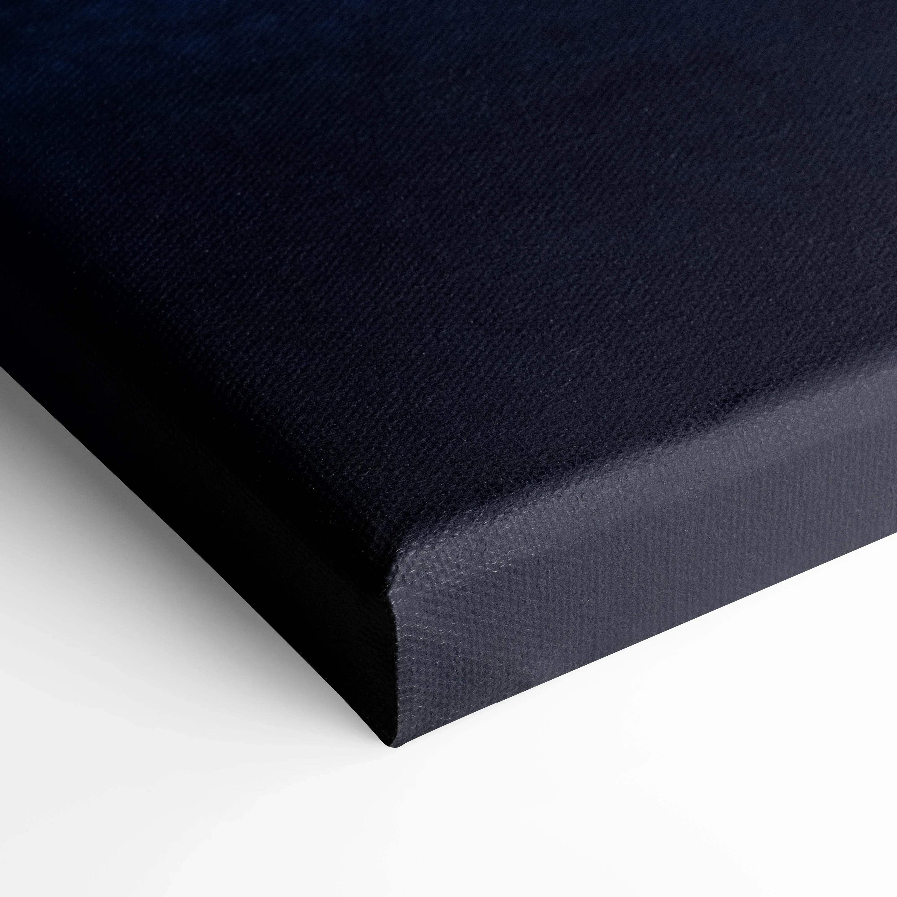Black textured canvas edge close-up showcasing high-quality wall art material and craftsmanship.