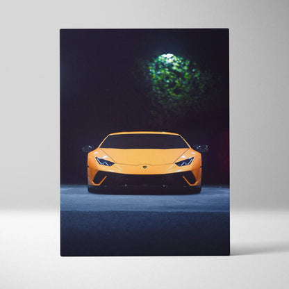Vertical canvas wall art of a yellow Lamborghini Huracan under green light in dark setting.