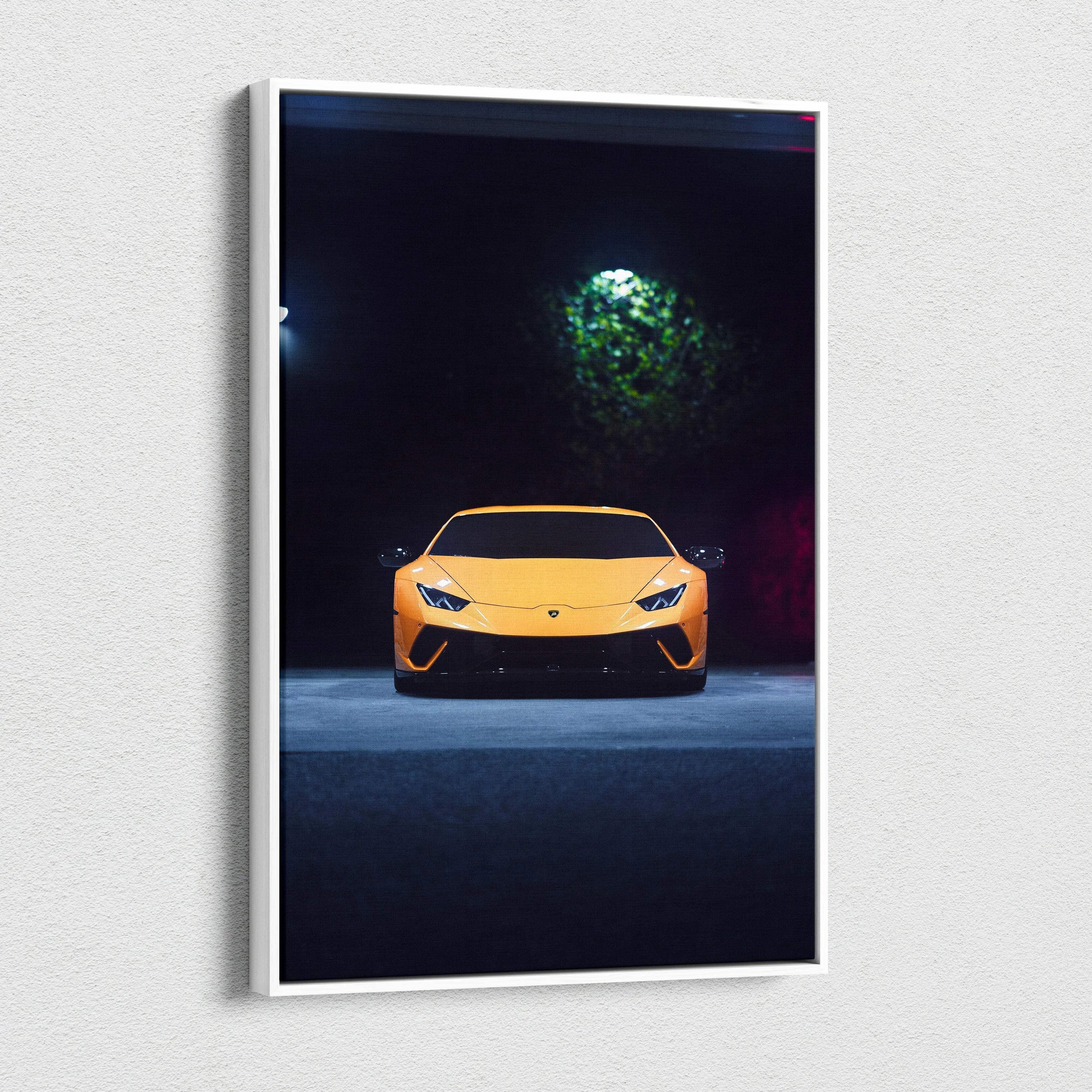 Yellow Lamborghini Huracan illuminated against dark background on vertical canvas wall art.