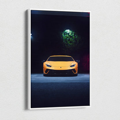 Yellow Lamborghini Huracan illuminated against dark background on vertical canvas wall art.