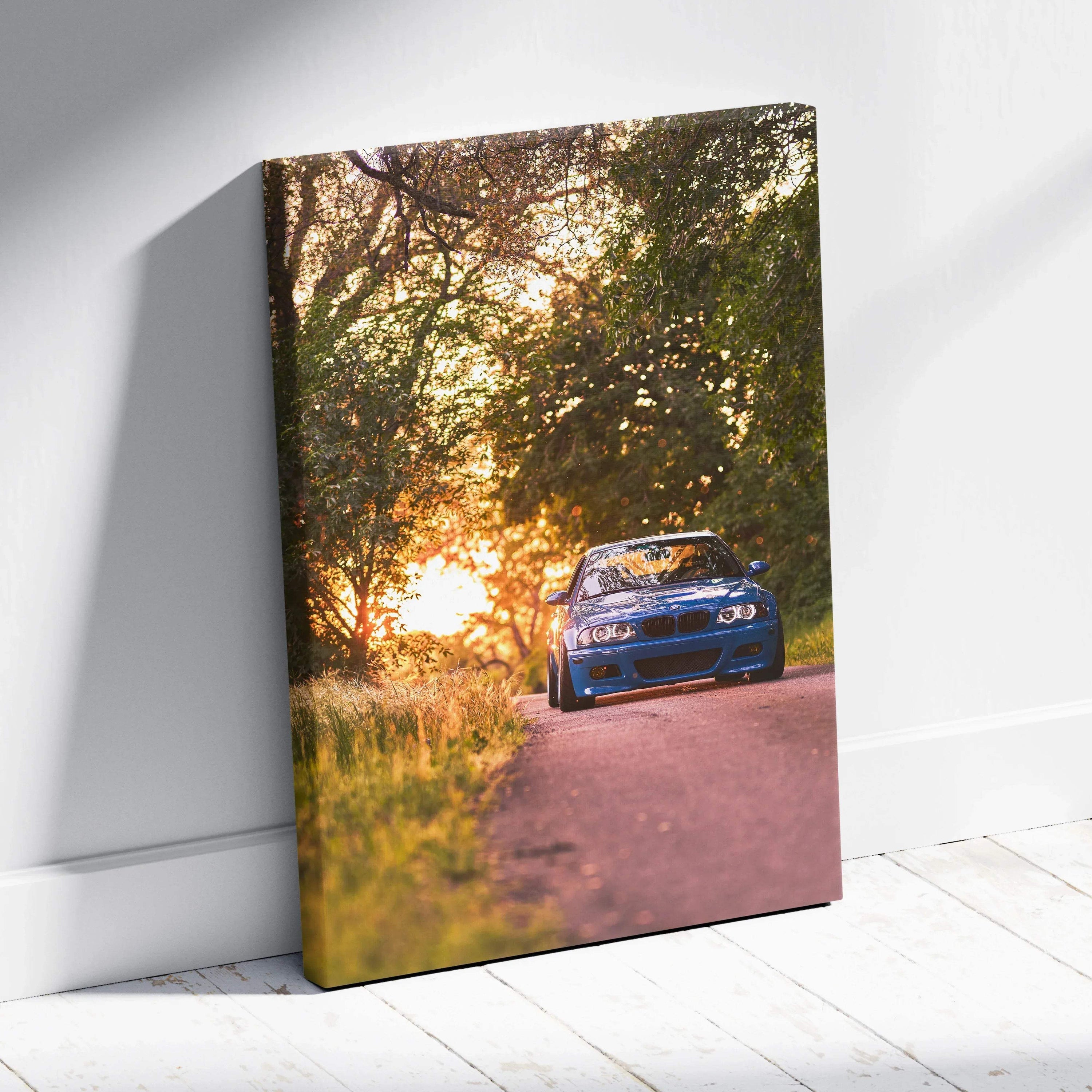 BMW E46 M3 blue car driving on sunset road vertical canvas wall art.