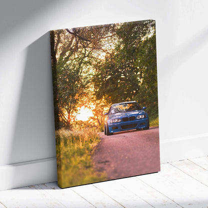 BMW E46 M3 blue car driving on sunset road vertical canvas wall art.