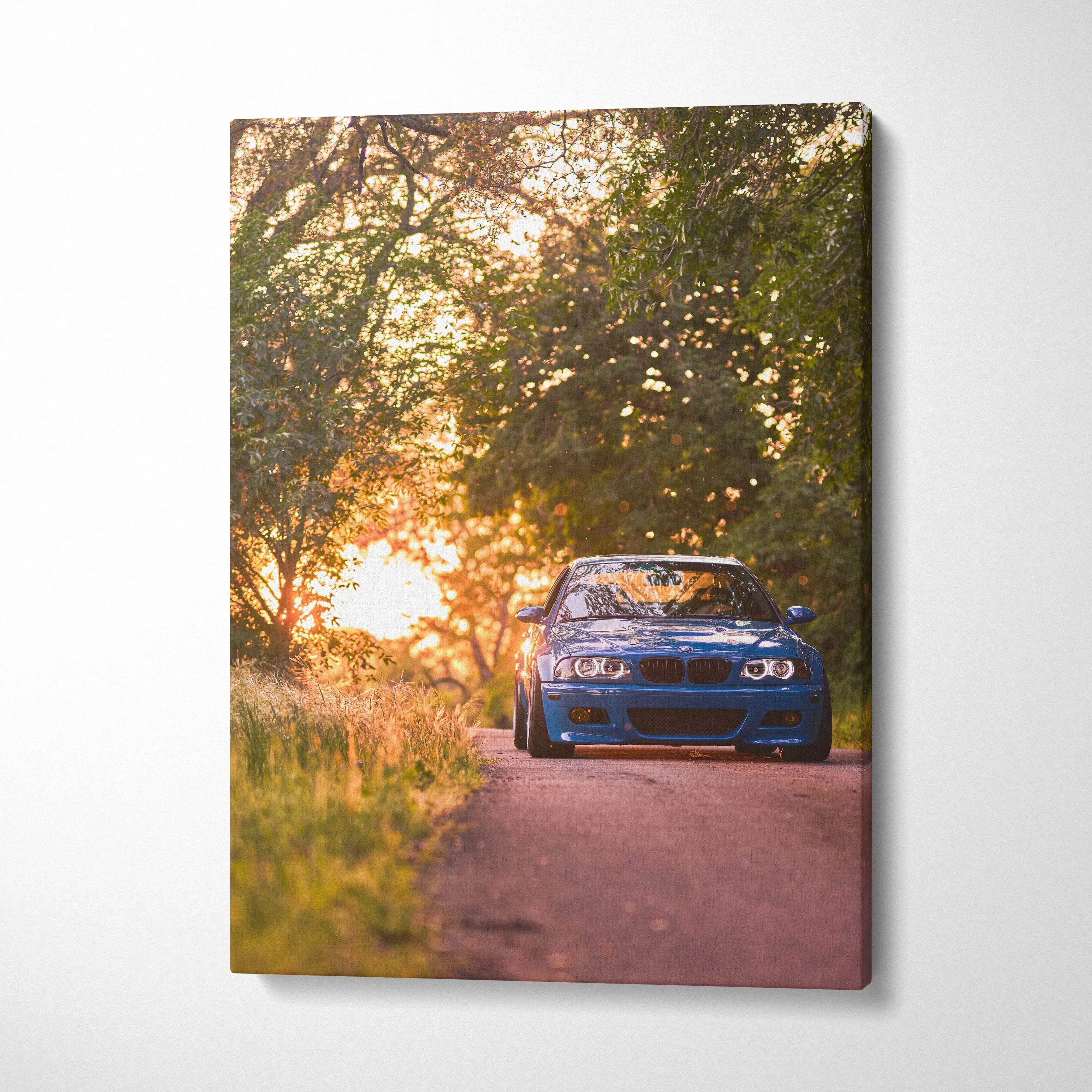 BMW E46 M3 blue car driving on sunset road vertical canvas wall art print.