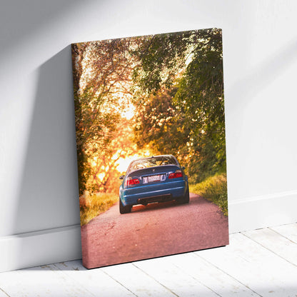 BMW E46 M3 parked on sunset-lit forest road canvas wall art print.