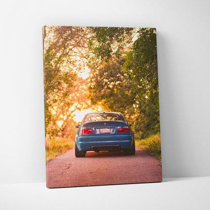 BMW E46 M3 rear view at sunset on road with trees, vertical canvas wall art print.