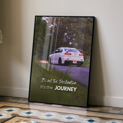Motivational poster wall art featuring white Mitsubishi Evo 10 with inspiring journey quote.