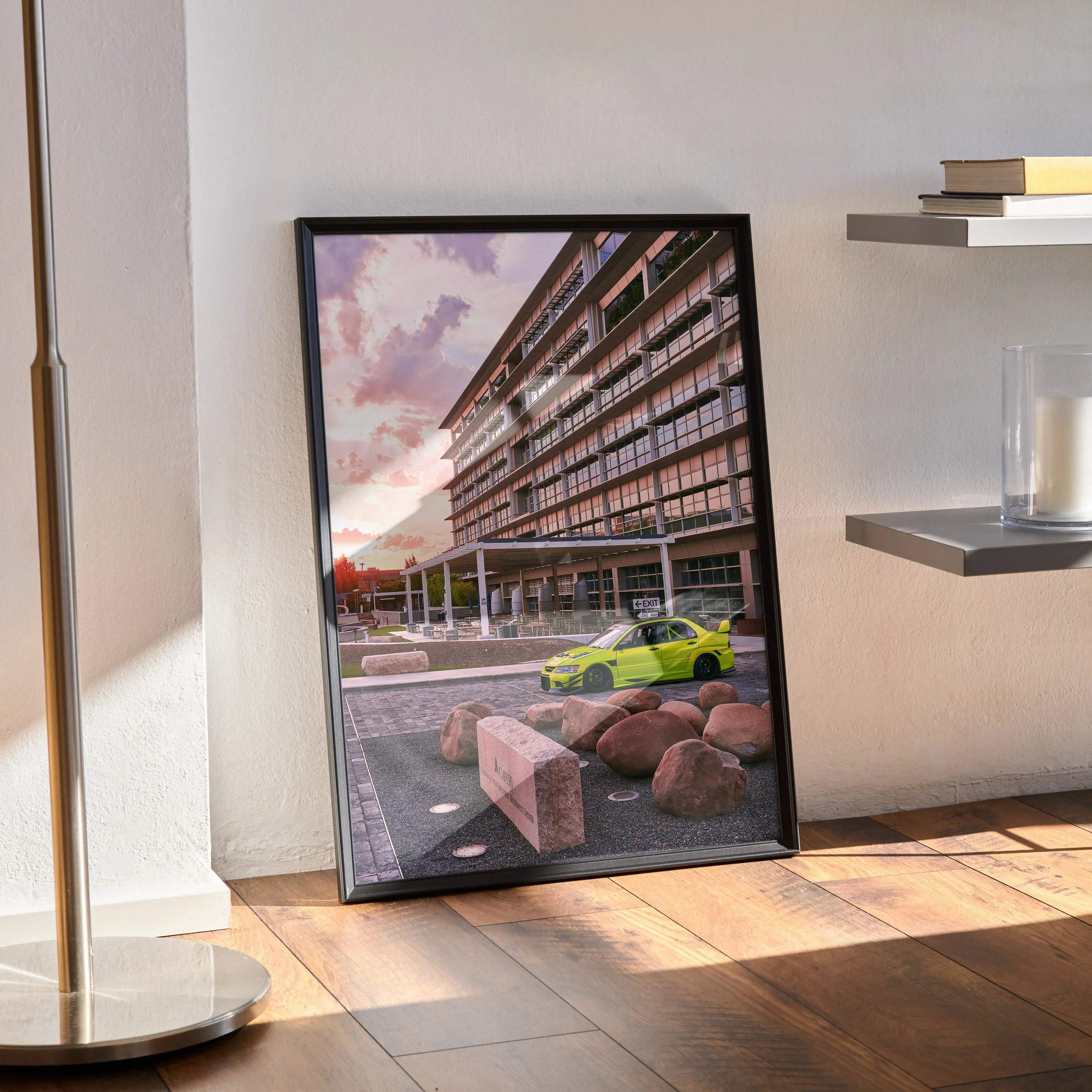 Mitsubishi Evo 9 poster with sunset background, modern building, and green car in black frame wall art.