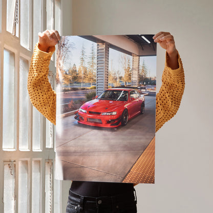 Poster of red Nissan 240sx S14 Kouki parked in sunlit modern garage, automotive wall art.