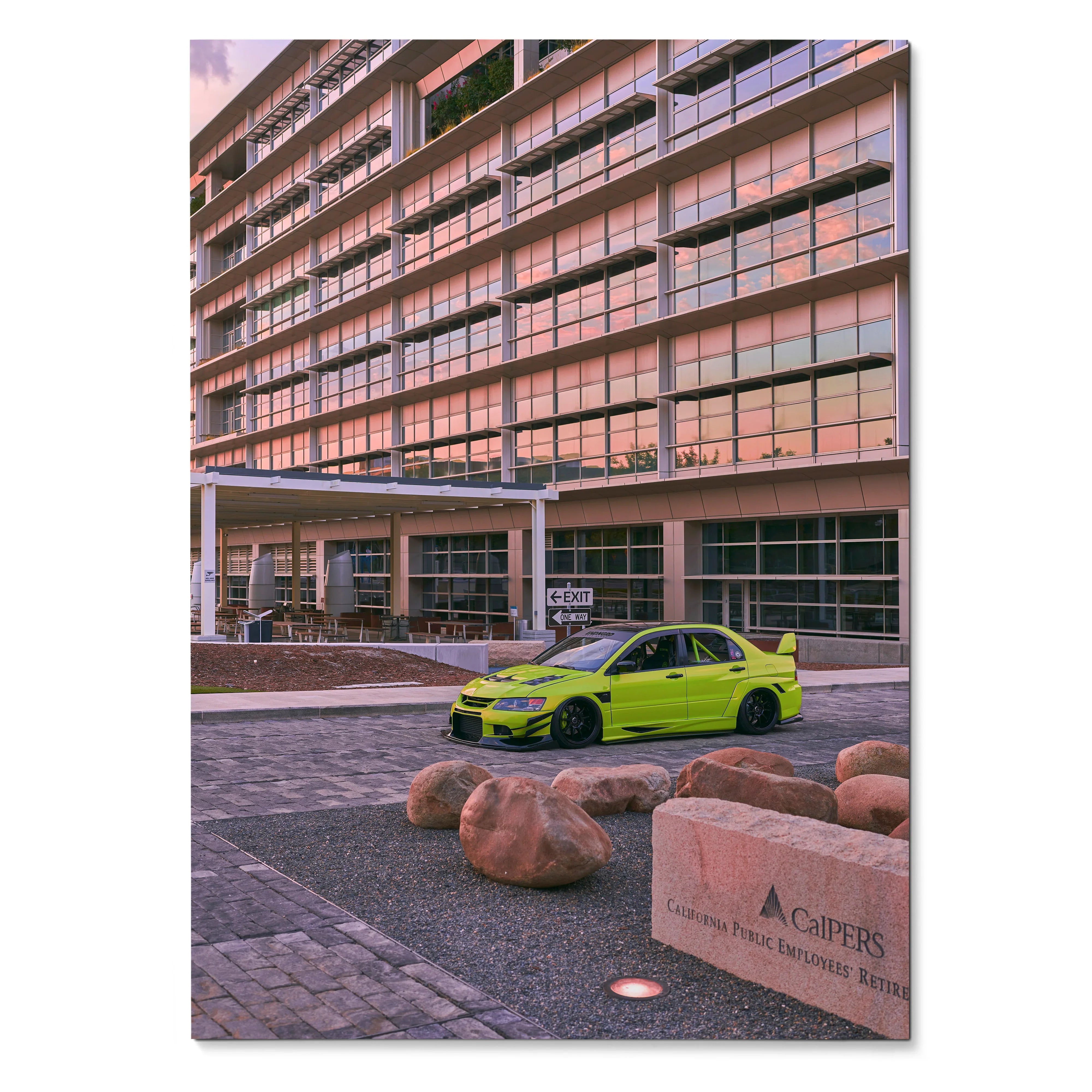 Vibrant poster featuring lime green Mitsubishi Evo 9 parked in front of modern glass building, automotive wall art.