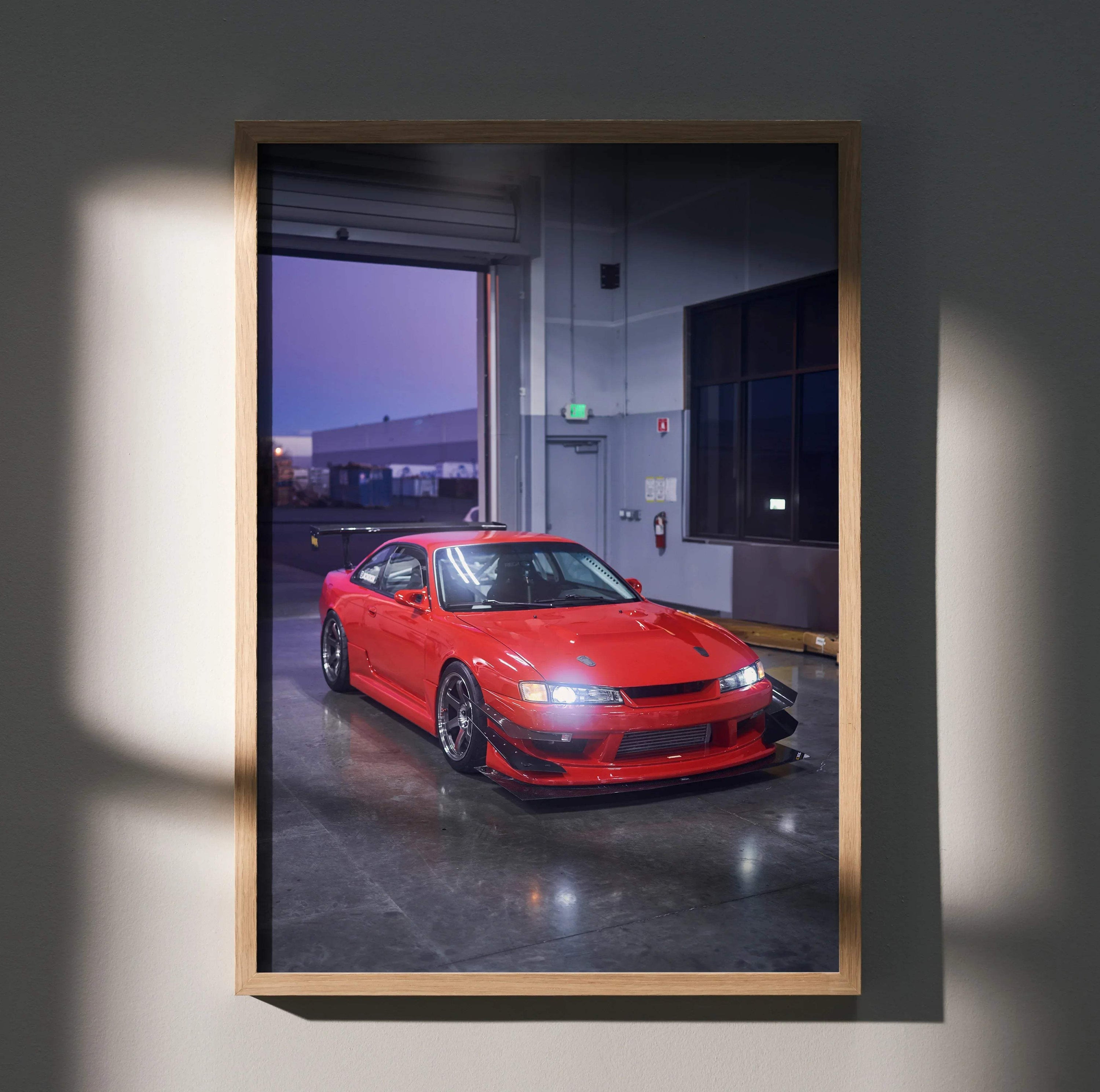 Red Nissan 240sx S14 Kouki parked indoors poster wall art in wooden frame.