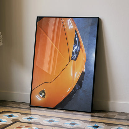Orange Lamborghini Huracan front close-up poster with sleek headlight wall art in black frame.