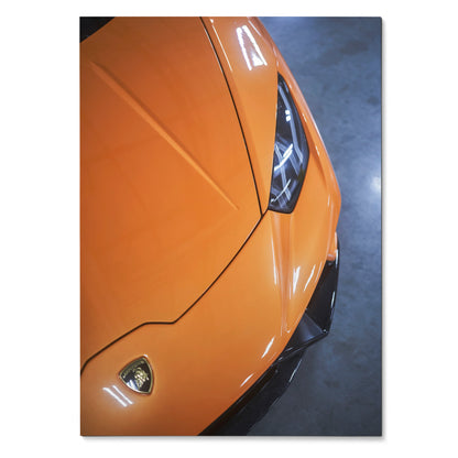 Orange Lamborghini Huracan close-up wall art poster showing sleek front hood and headlight design.