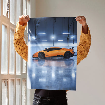 Lamborghini Huracan in vibrant orange parked indoors reflected on glossy floor poster wall art.